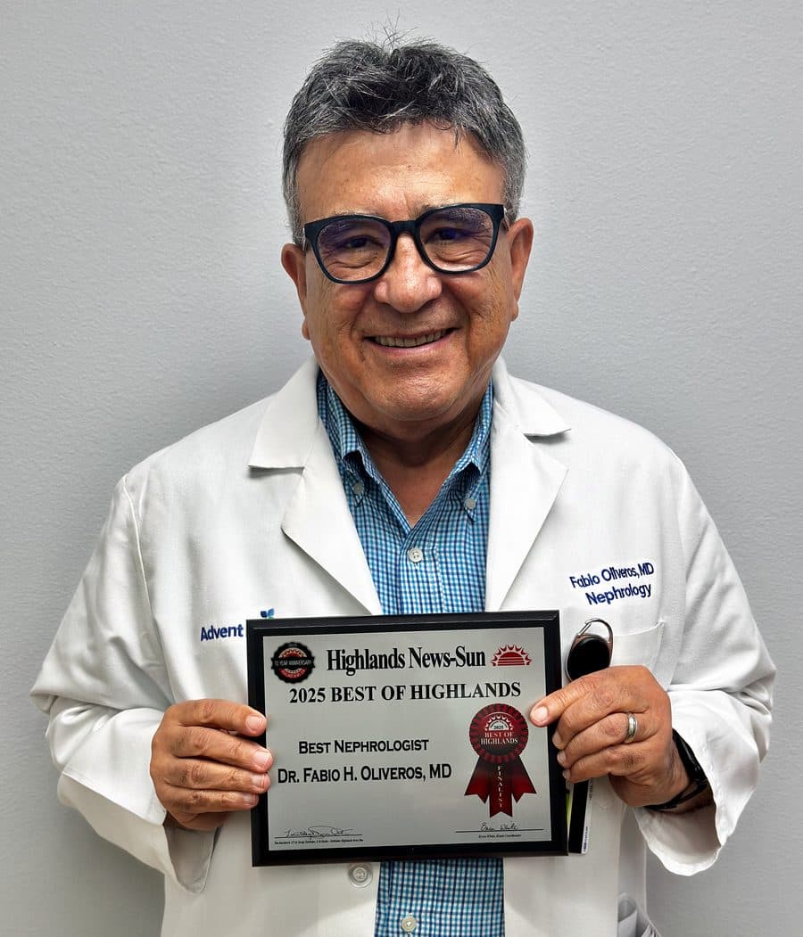 Dr. Fabio Oliveros holding his 2025 Best of Highlands finalist plaque for Best Nephrologist.